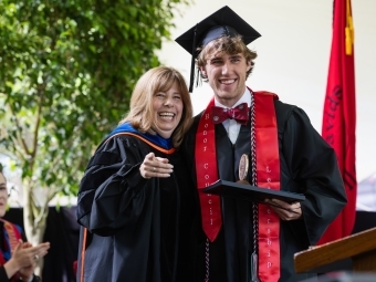 Student Mills Jordan with Stacey Riemer During Commencement 2025